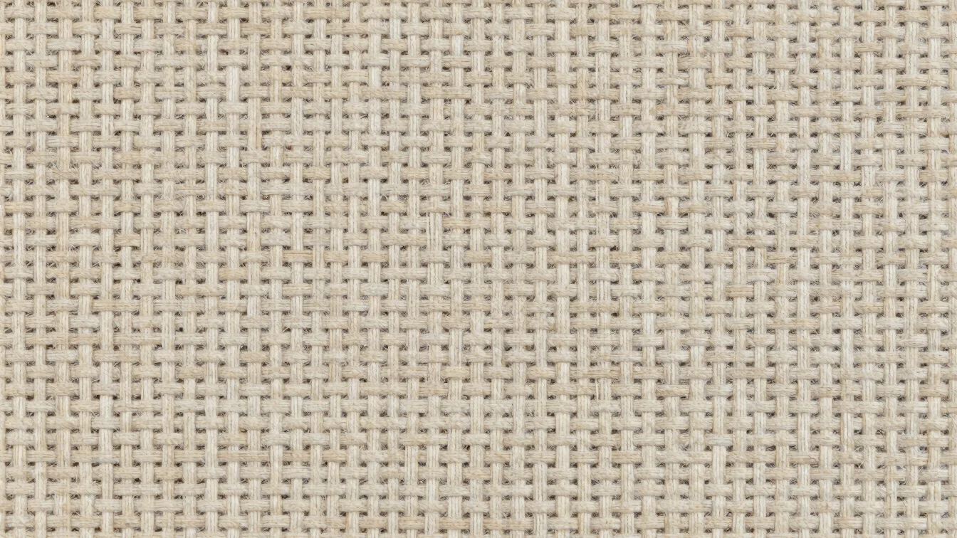 Macro overhead swatch of tightly woven upholstery fabric on a neu