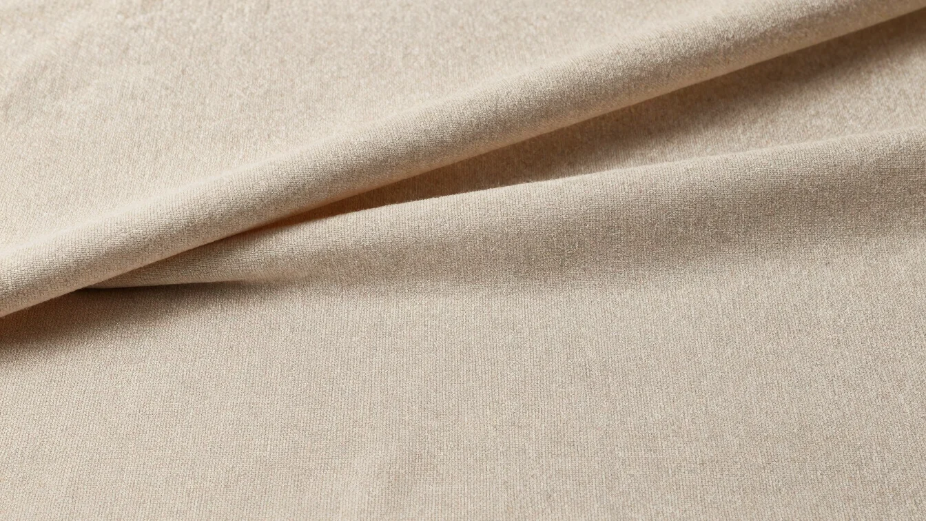 Simple straight-on view of draped drapery fabric lengths on a neu
